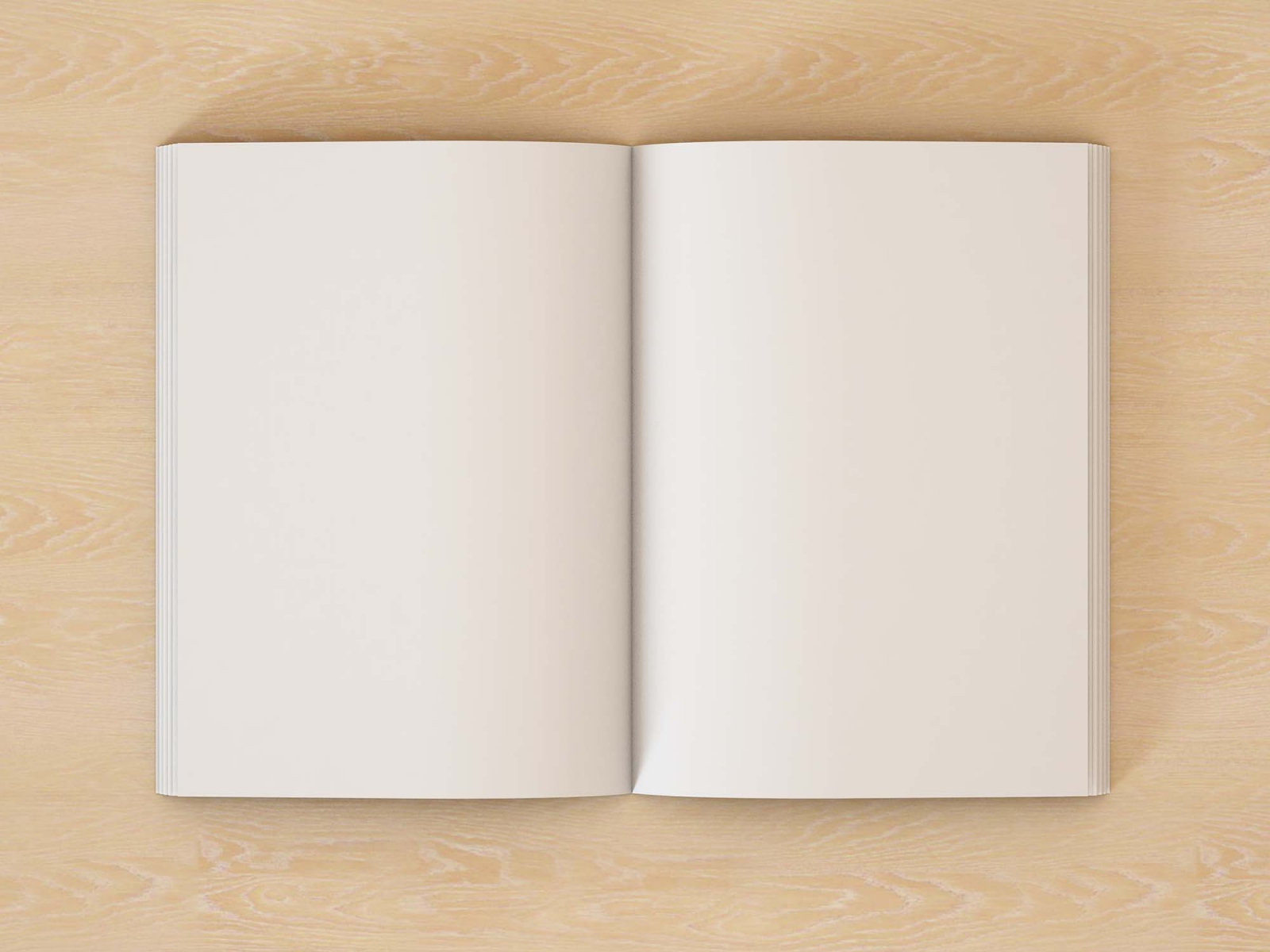 An open book page mockup laid flat on a wooden surface, offering a clean slate for thoughts, sketches, or writings.