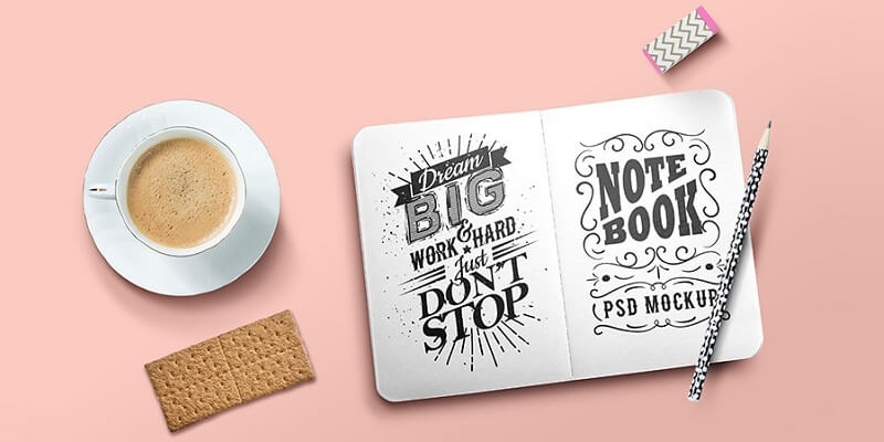 An open sketchbook mockup with motivational quotes "dream big" and "work hard, don't stop" alongside a cup of coffee, a pencil, an eraser, and a biscuit on