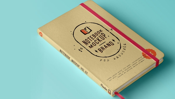 A hardcover notebook mockup with a beige cover and a red elastic band, featuring a graphic icon and text showcasing it as a presentation model for brand identity, set against a pastel blue background.