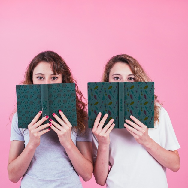 Young Girls Holding Book