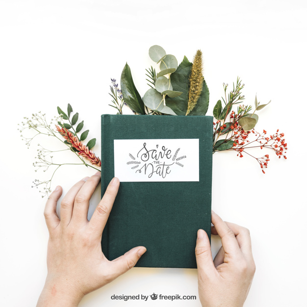 Hands Holding Book with Plants