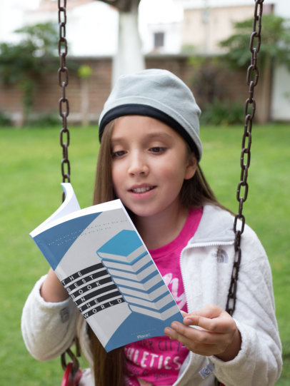 Happy Kid Reading Book on a Swing