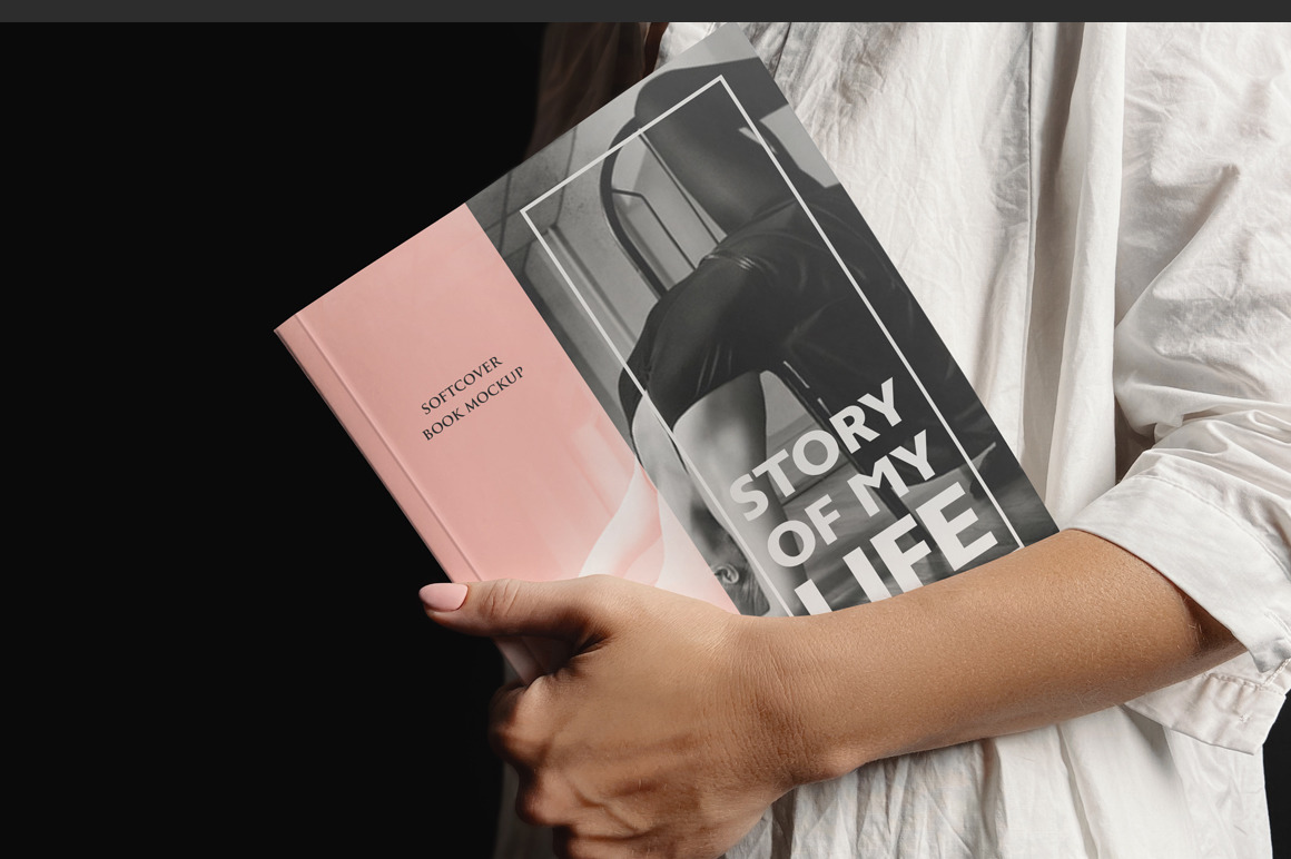 Softcover Book Held By A Woman